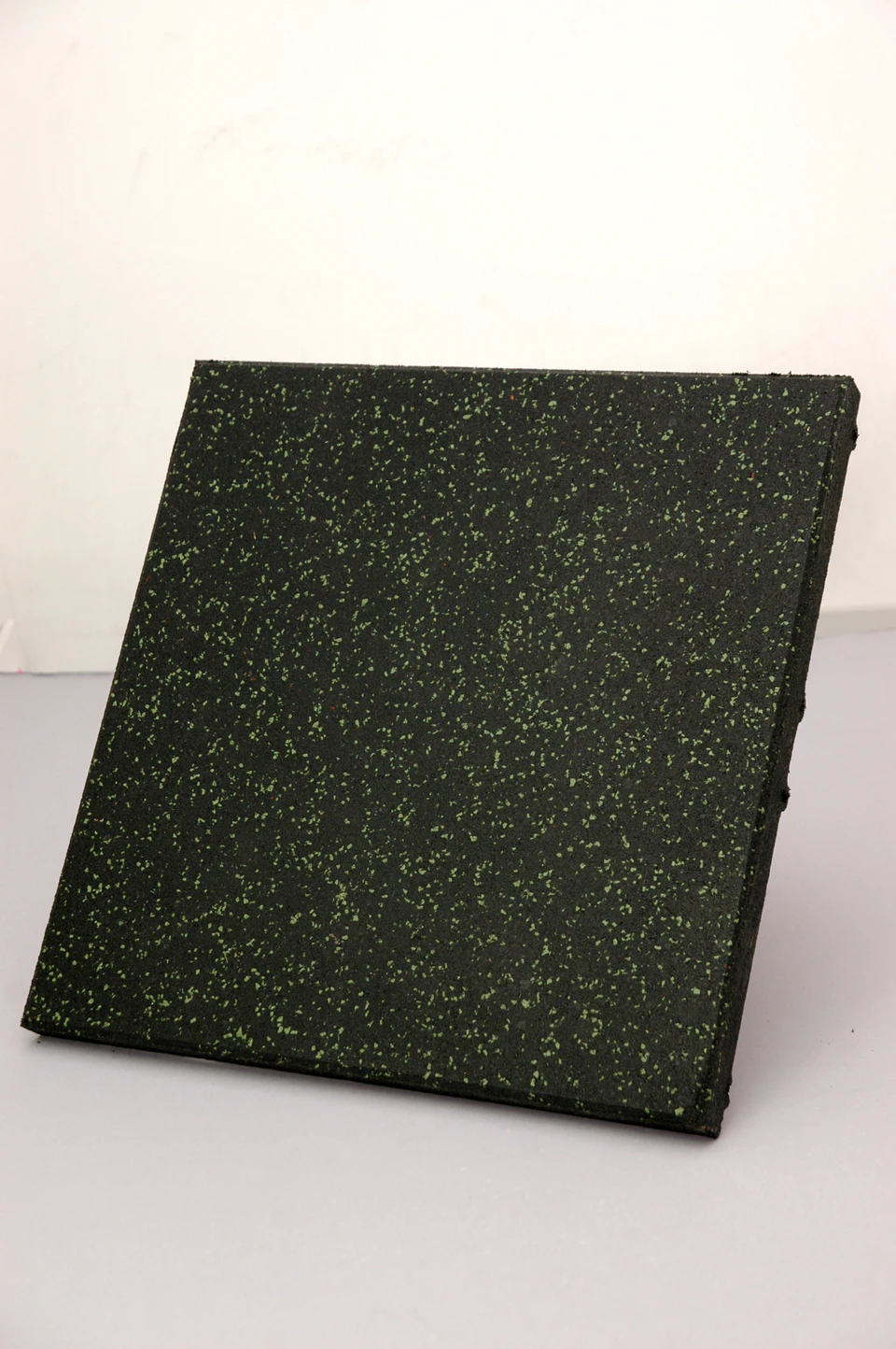 Black recycled rubber tile with green fleck