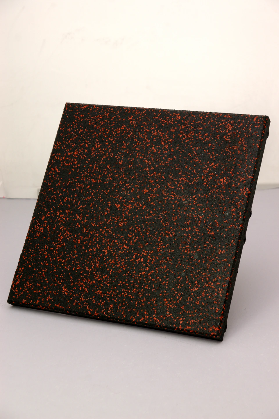 Black recycled rubber tile with red fleck