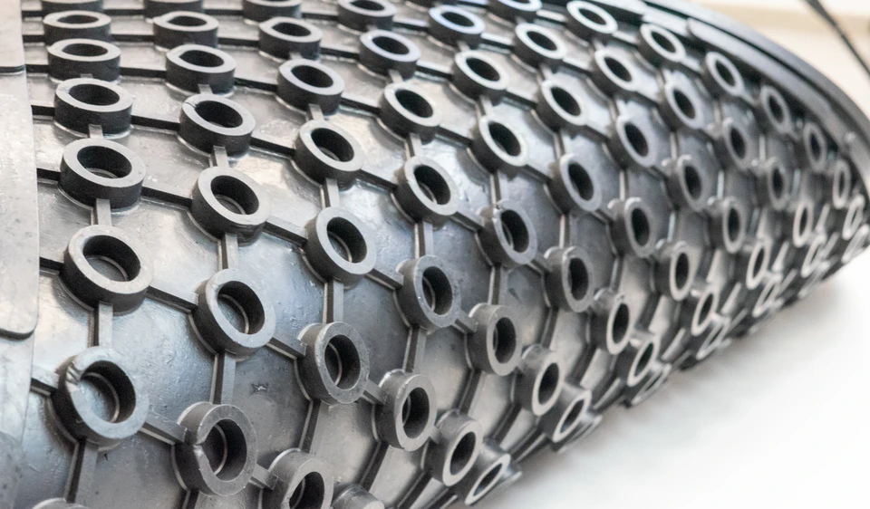 Agri-Tech rubber mat drainage ring surface detail
