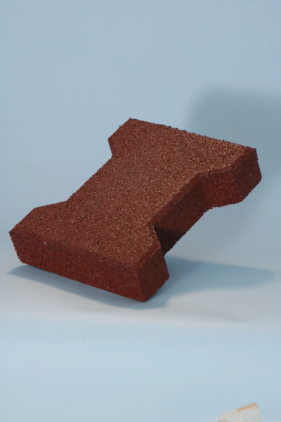 Red recycled rubber Behaton interlocking paver close-up